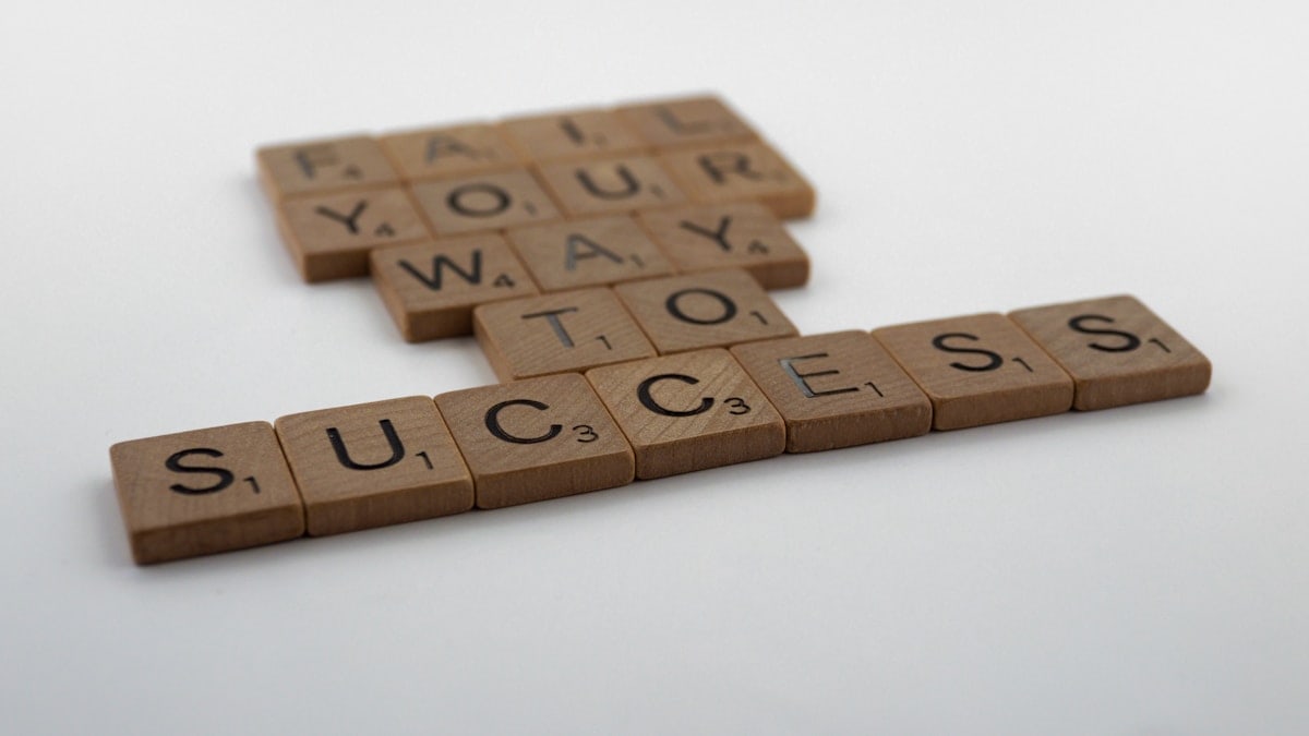 scrabble, scrabble pieces, lettering, letters, wood, scrabble tiles, white background, words, quote, fail your way to success, persevere, don't give up, try again, get up, move on, keep innovating,